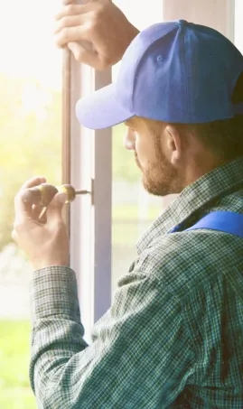 Tradesperson fitting a window